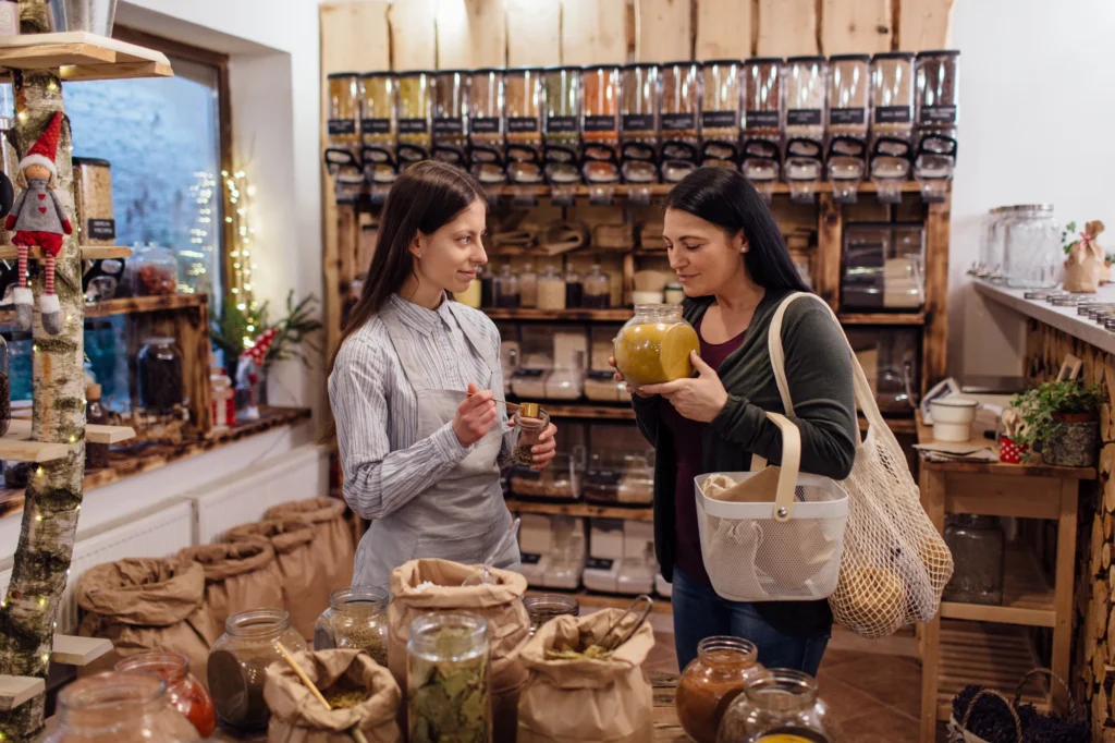 cheerful-shop-assistant-helping-customer-in-packag-2023-11-27-05-17-46-utc cheerful-shop-assistant-helping-customer-in-packag-2023-11-27-05-17-46-utc